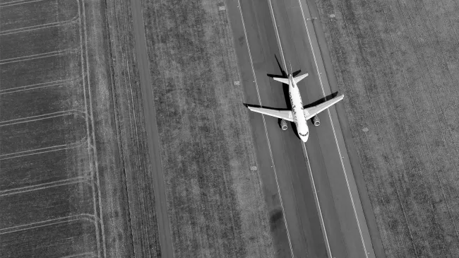 A Boeing jet taxis down a runway